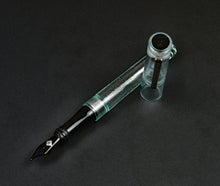 Load image into Gallery viewer, A Franklin-Christoph Model 03 Iterum in Antique Glass &amp; Onyx rests on a dark surface.