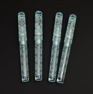 Four light blue Franklin-Christoph pens, including one Model 03M Antique Glass Abstract Diamond, on a black background.