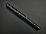 Franklin-Christoph 03M Artisan Delrin - Diamond Abstract fountain pen with a dark gray background.