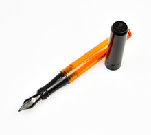 Load image into Gallery viewer, Franklin-Christoph Model 03 Modified Fountain Pen - Halloween Edition with an orange translucent barrel, black cap, and nib.