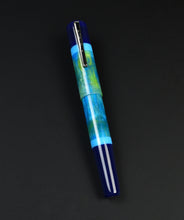 Load image into Gallery viewer, Franklin-Christoph Model 19 Kingston SE, blue-green marbled fountain pen with silver clip on a black background.