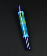 Franklin-Christoph Model 19 Kingston SE, blue-green marbled fountain pen with silver clip on a black background.