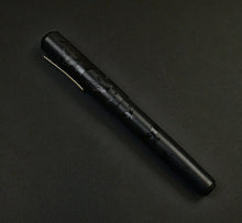 Load image into Gallery viewer, Franklin-Christoph Model 31 Black Pen Society fountain pen diagonally displayed on a dark background.
