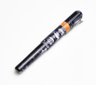 Franklin-Christoph Model 40 Panther Fountain Pen - Smoke & Orange SE with silver clip and Diamondcast band on white.