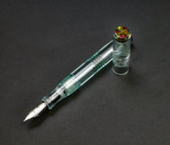Franklin-Christoph Model 46 Cor FP in Antique Glass & Cathedral, shown diagonally on a dark surface.