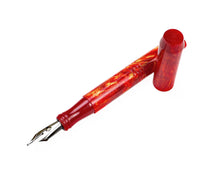 Load image into Gallery viewer, A red and gold marbled fountain pen with a matching red cap, displayed diagonally on a clean white background.
