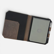 Load image into Gallery viewer, Franklin-Christoph Command Center Padfolio in distressed brown boot leather with black elastic closure and tan stitching. Holds notepad, pen, and documents.
