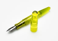 A Franklin-Christoph Pocket 66 Fountain Pen - Olivae SE, cap off, in translucent yellow acrylic, on a white background.