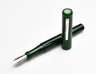 Franklin-Christoph Model 03 Iterum Fountain Pen in emerald acrylic with a silver clip and a white translucent finial.