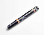 Franklin-Christoph Model 19 Fountain Pen - Smokey Orange SE, #6 nib, silver clip, orange rings on white background.