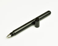 Franklin-Christoph Model 25 Eclipse Fountain Pen - Black Diamond SE, uncapped, on white background.