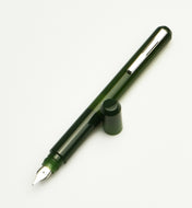 Franklin-Christoph Model 25 Eclipse Fountain Pen in Vintage Green with silver clip, uncapped, on white background.