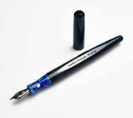Franklin-Christoph Model 65 Stabilis FP in Diamondcast Blue Orchid, uncapped on a white surface.