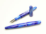 Two Franklin-Christoph Pocket 66 Fountain Pens, Distant Earth SE, blue marbled resin, shown uncapped and capped.