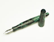Franklin-Christoph pocket 66 FP - Spanish Moss SE, cap off and next to pen, silver nib, marbled green acrylic.
